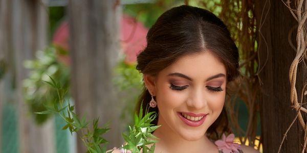 Bridesmaid smiling in a floral dress, wearing beautiful bridal makeup
bridal bouquet and bridesmaid dress