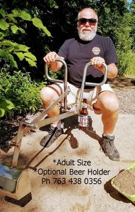 Adult ride on sandbox digger backhoe.