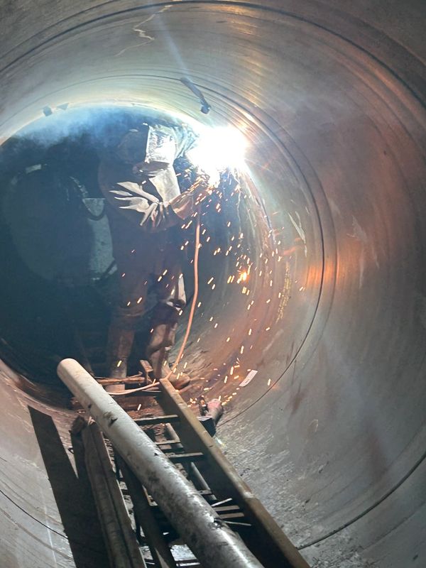 Welding inside 66 inch casing pipe