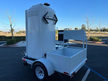 alt="Portable restroom trailer with onboard generator for disaster zones"
