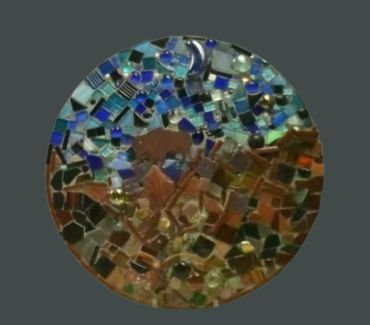 Whimsical mosaic of bear and moon in blue-brown tones.