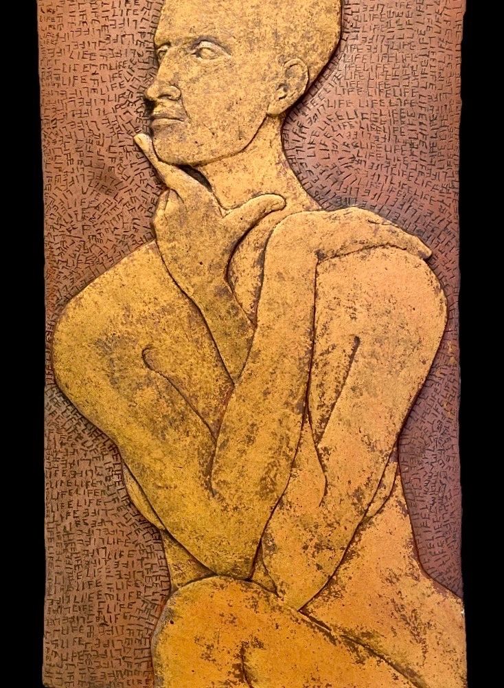 Self portrait, 22”x13”x2”, stoneware clay, oxides on surface.