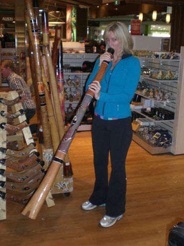 Proving mad skills on a didgeridoo at the end of a trip to Australia.