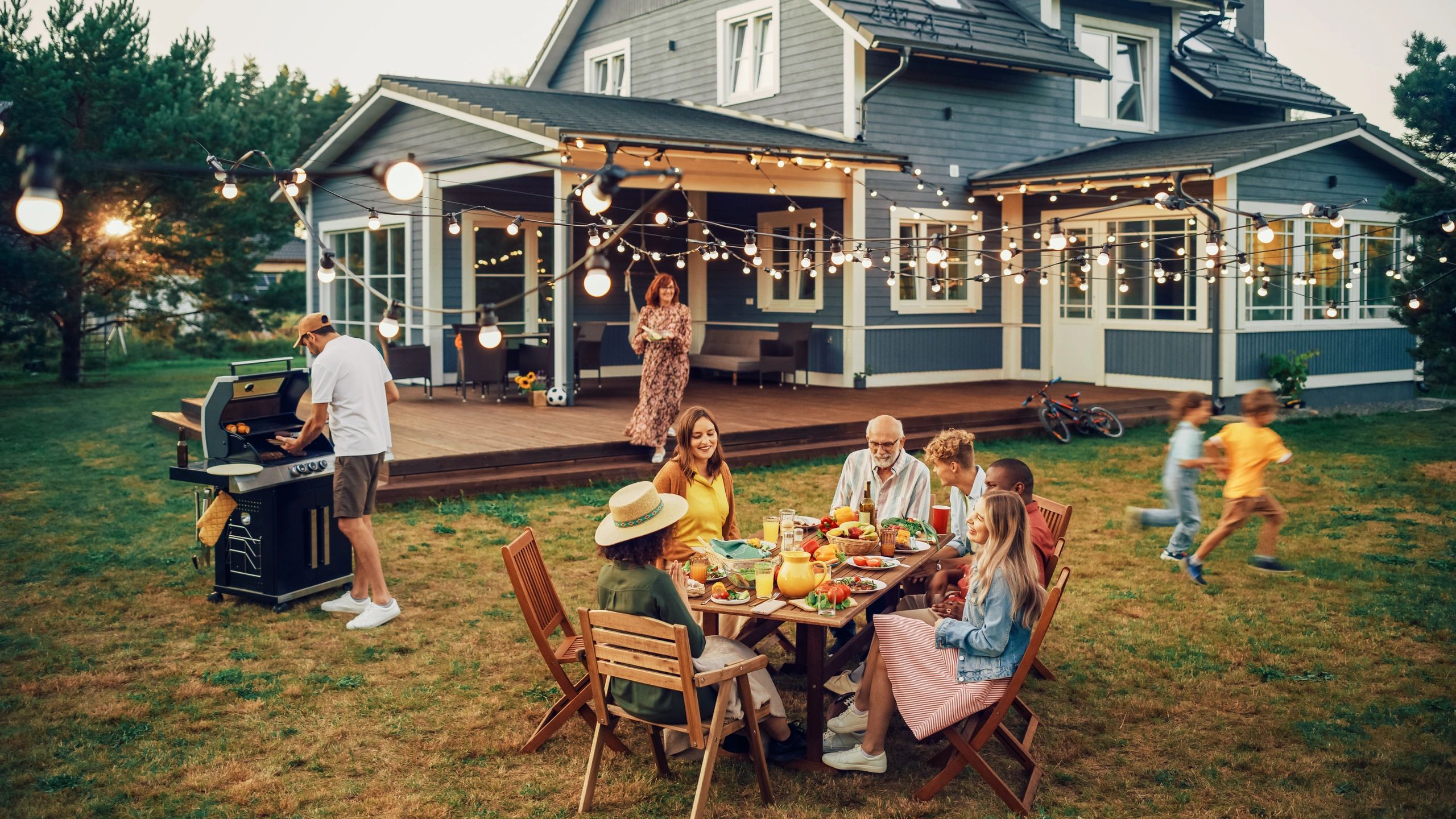 A family enjoying a yard that has had a pest control mosquito- and pest control treatment.