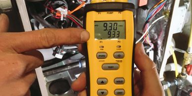 Checking static pressure on furnace. Also checking gas pressure