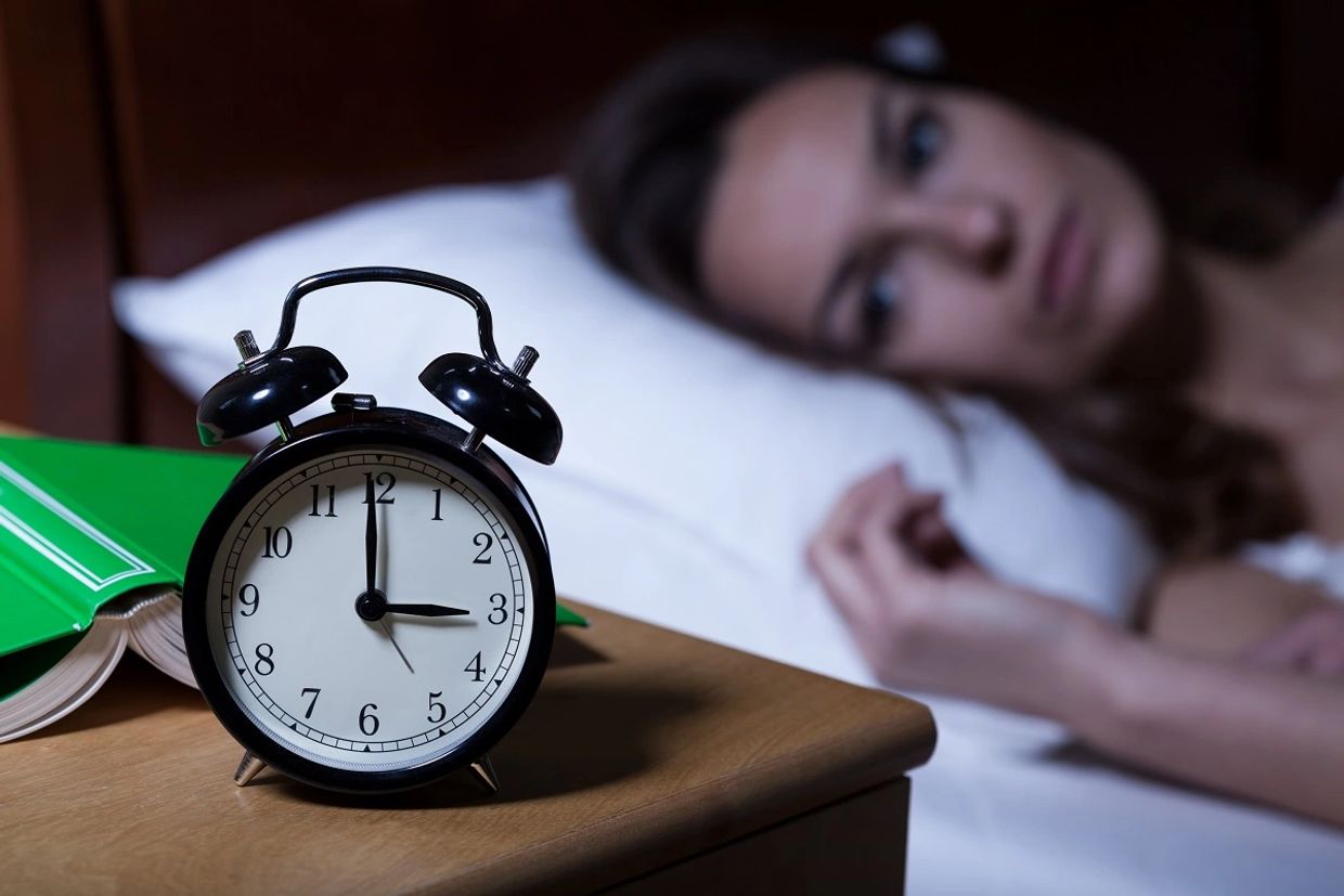 Woman awake with insomnia