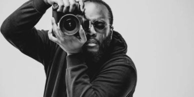 Man taking a photo with a camera.