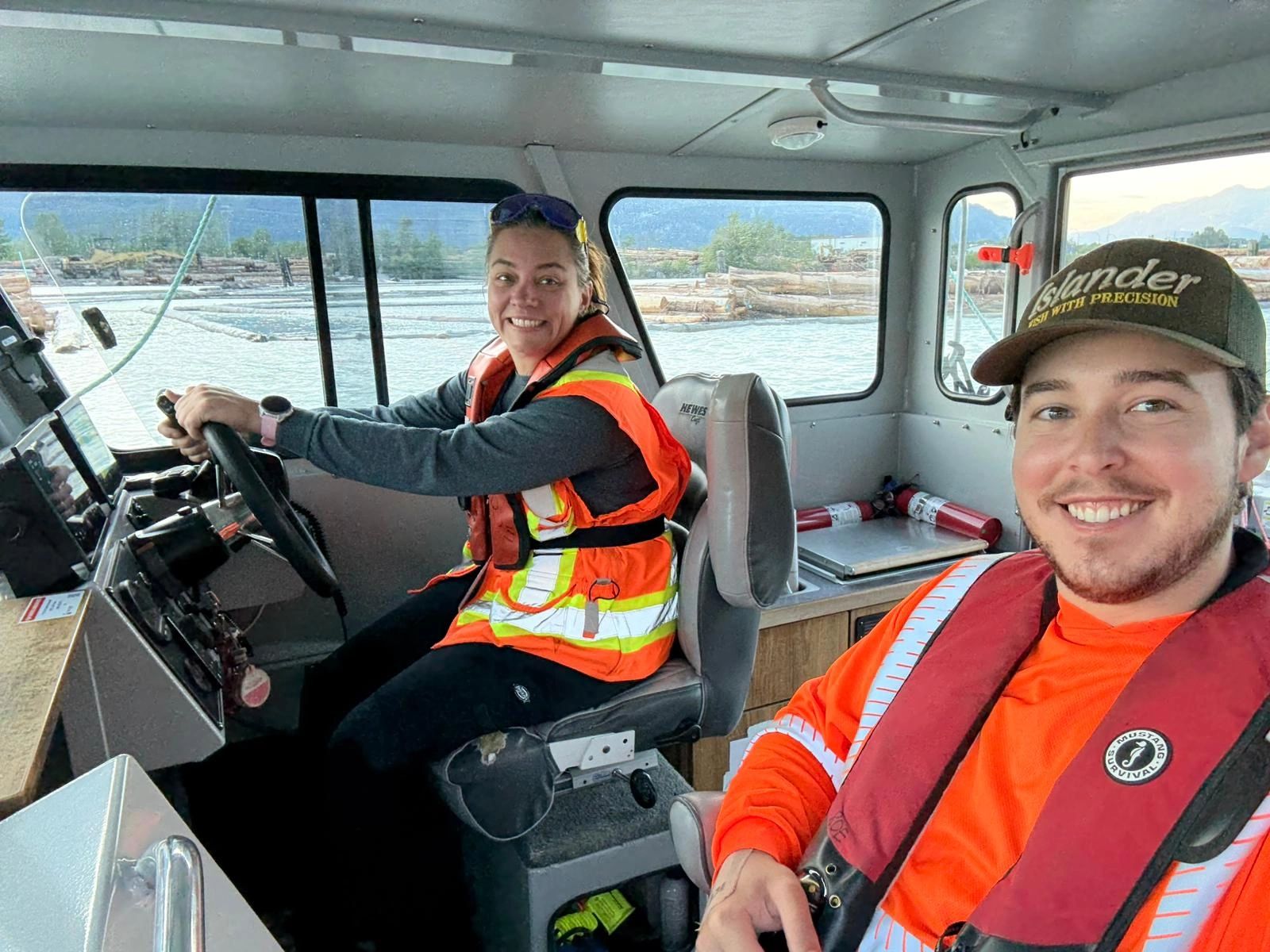 Stack of books next to pencils in a holder and a camera.