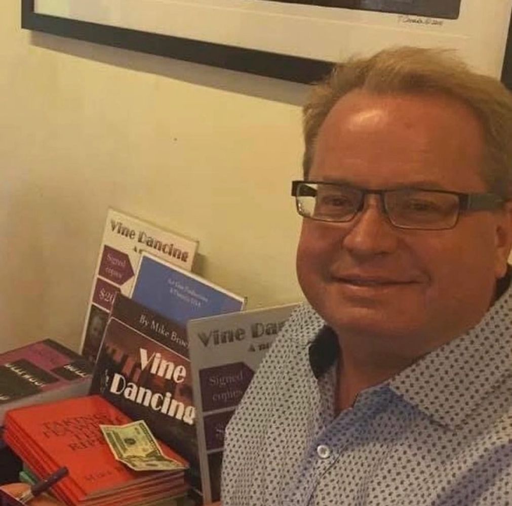 Mike Broemmel, playwright and author, at book signing.