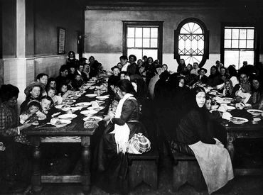 Dining area for immigrants at Ellis Island, New York, back in the day.