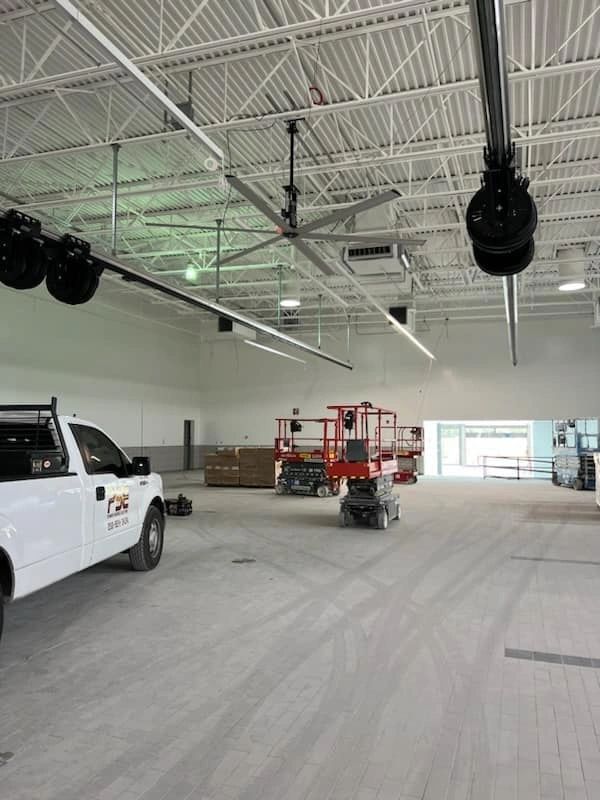 Power Source truck parked inside building of a project in progress