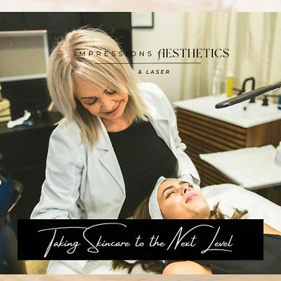 Aesthetician giving skincare treatment with a smile.