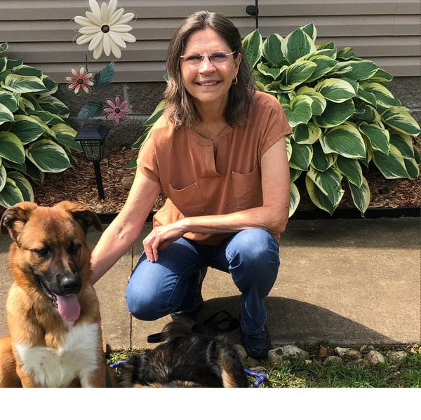 dog trainer outside with her dog