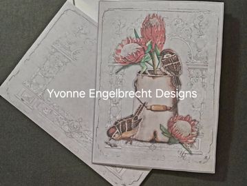 Greeting card with floral design and embossed details, featuring pink flowers and a rustic pot.