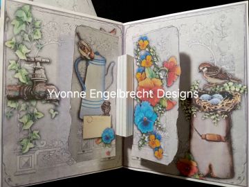 Intricately designed pop-up card featuring birds, flowers, and vintage elements.