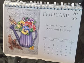 Calendar page for February 2025 with floral and bird illustration.