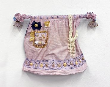 Matriarch, Apron, Ribbon, Embellishments, Wire, Fiber, 21” x 31” x 7.5”, 2022