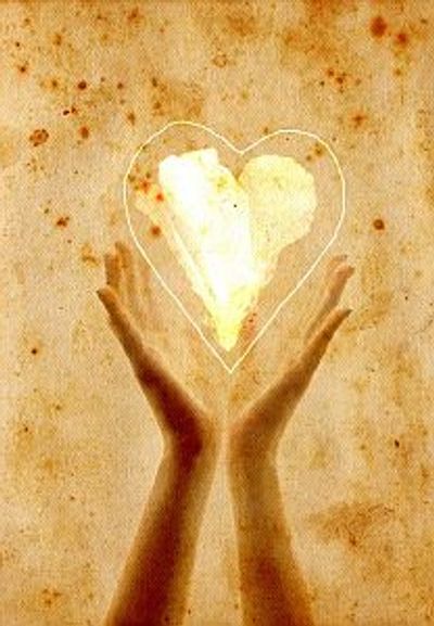 Massage therapy hands holding glowing heart Yonge Eglinton Massage