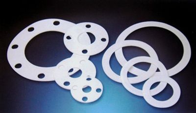 Various sizes of white plastic gaskets.