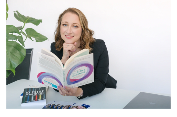 Woman in black blazer reading a coaching book with a laptop nearby.coach training
First Responder Coaching
Jennifer Anderson
keynote speaker
Two Roads Coaching