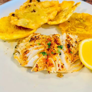 Cod Fillet grilled to perfection served with crispy tostones.