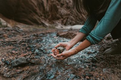 A woman holding stones