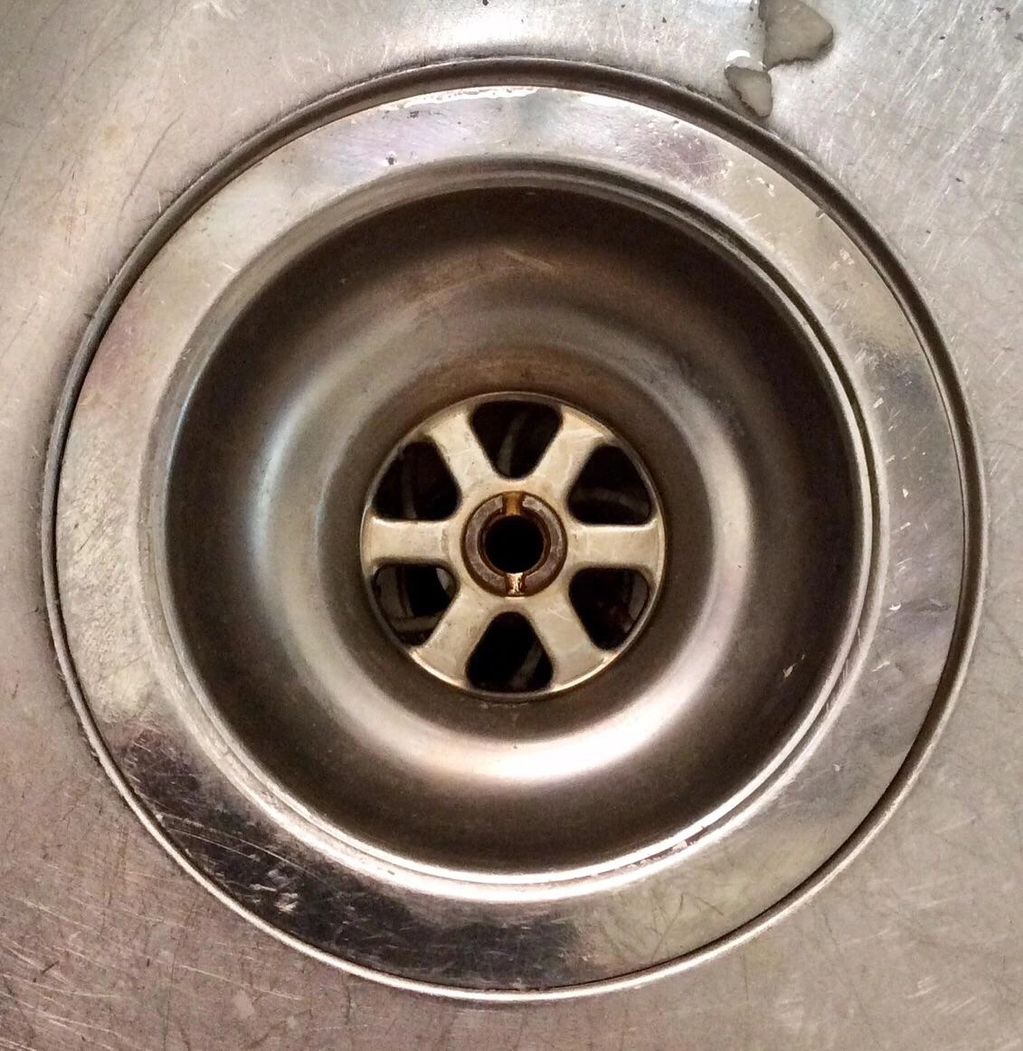 Sink Strainer showing screw to remove