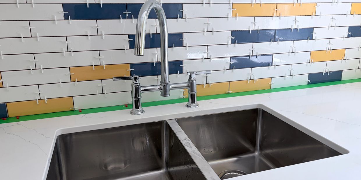 complete rough in and install of kitchen sink and faucet