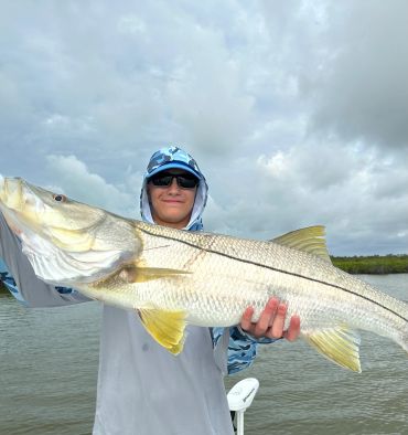 Man holding a Snook in Key Largo