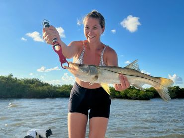 Woman holding a Snook in Key Largo