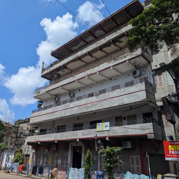 Old multi-story building on a sunny day.