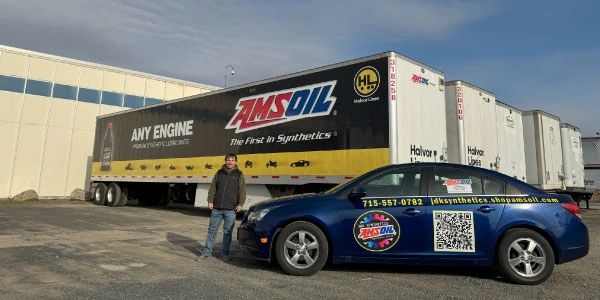 Owner of JDK Synthetics in front of AMSOIL trailer
