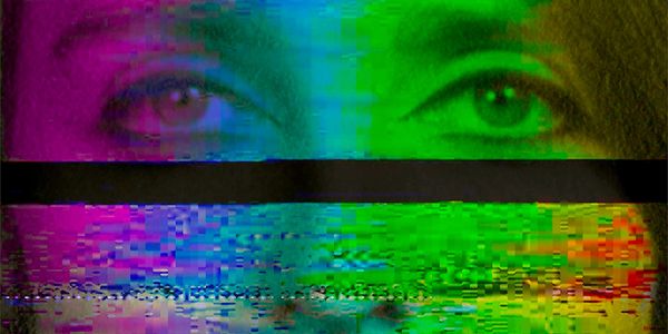 Glitched digital image of a person's eyes with vibrant color distortions.
