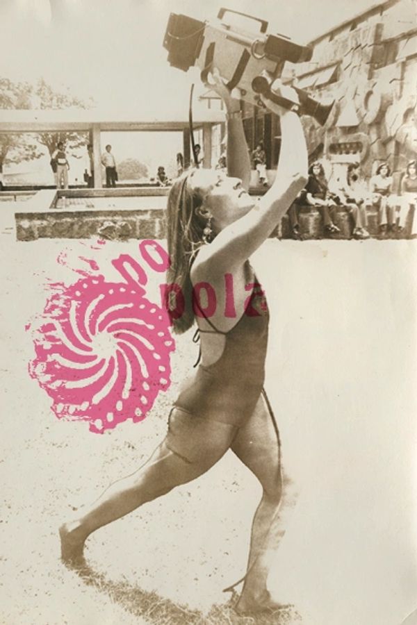 Woman in a swimsuit holding a vintage camera above her head outdoors.
