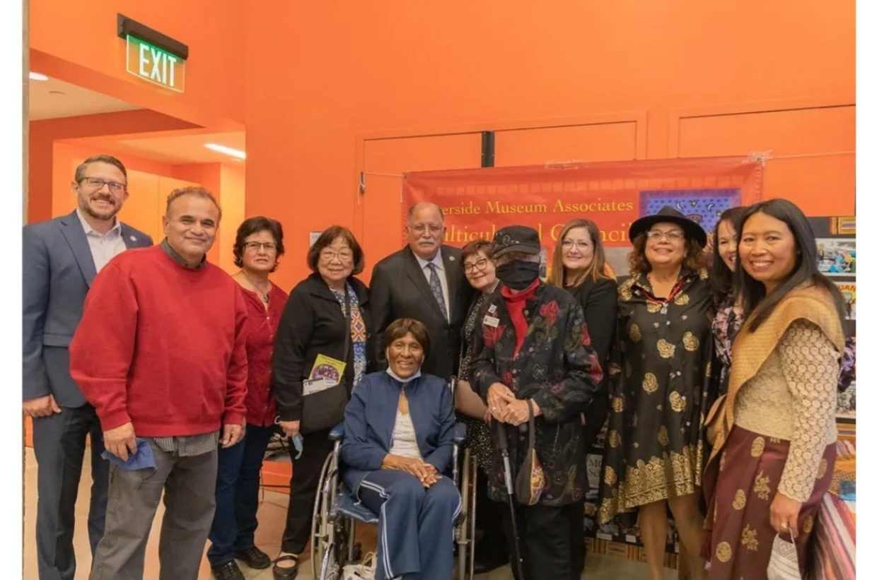Vilayvanh Bender and a group of people at the Riverside Museum Associates Multicultural Council