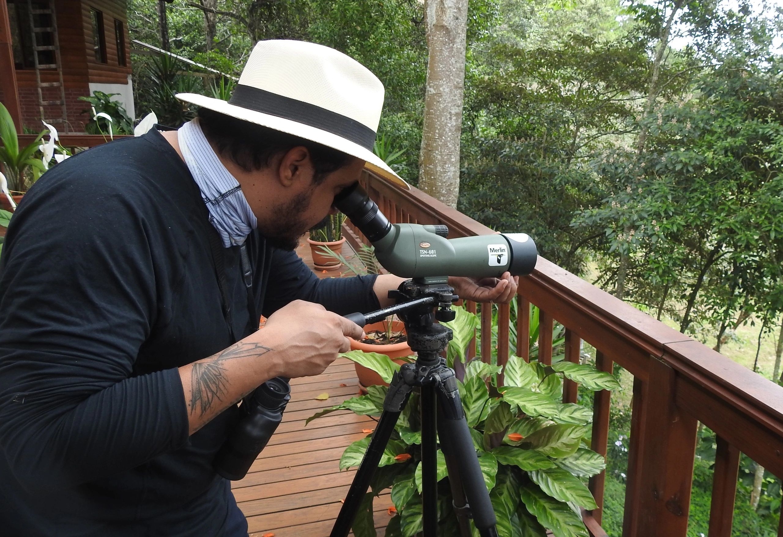 a person using a spotting scope