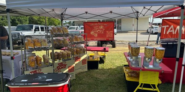 Popcorn vendor stall at an outdoor market.
