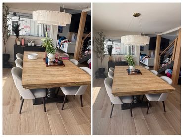 Modern dining room with wooden table and elegant chairs.