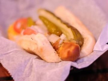 Lightlife Veggie Dog, Mustard, Relish, Onions, Tomatoes, Pickles, Sport peppers, Celery Salt served