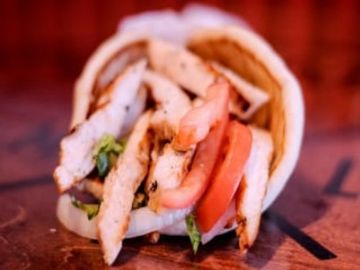 Charbroiled Chicken Breast, Lettuce, Tomato, Onion, Tzatziki sauce (on the side) served on Pita Brea