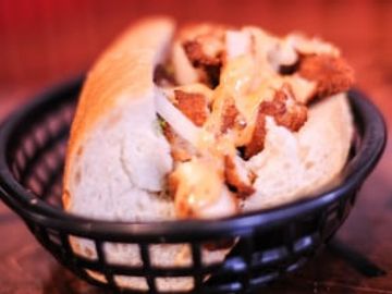 Slim's Homemade Classic Breaded Chicken, Lettuce, Onions & our Homemade Sweet & Spicy Mayo served on