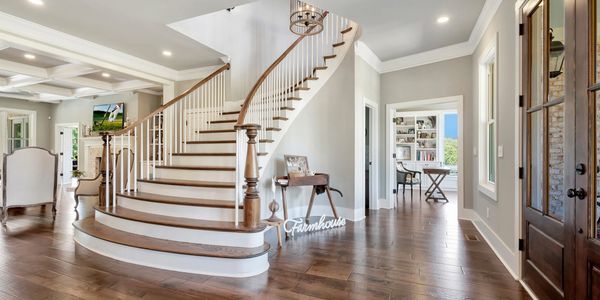 Luxury custom home foyer with curved staircase built in Georgia