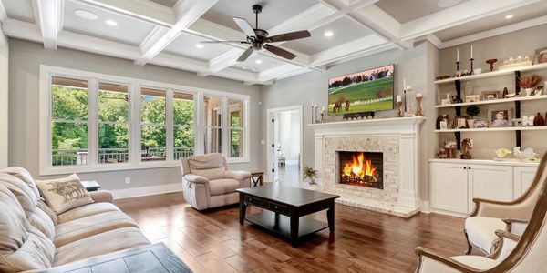 Luxury custom home modern farmhouse living room with coffered ceiling in Georgia