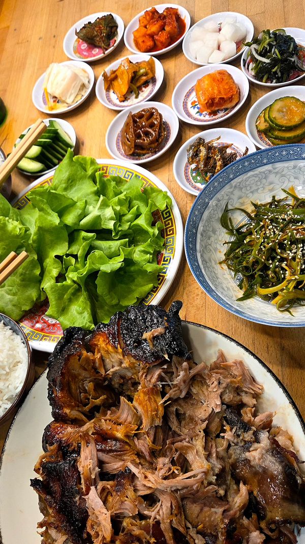 Bossam.  Made with an 8 hour slow roasted Boston pork butt served alongside traditional banchan.