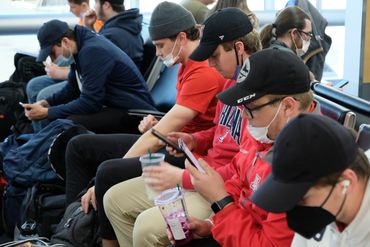 Chris Fritz, Anthony Cusanelli, Anthony Ciurro and Ryan Heck wait for a flight at St. Louis airport.