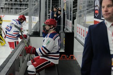 Anthony Cusanelli sits on the bench at the ACHA 2022 National Tournament.