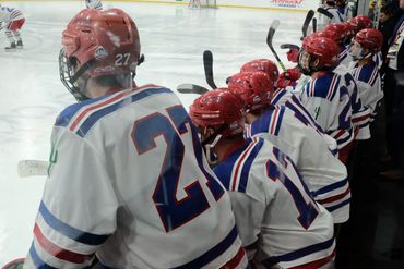 University of Arizona hockey team on the bench at the ACHA 2022 National Tournament.