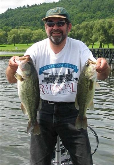 Fishing guide Allan Green with two largemouth bass