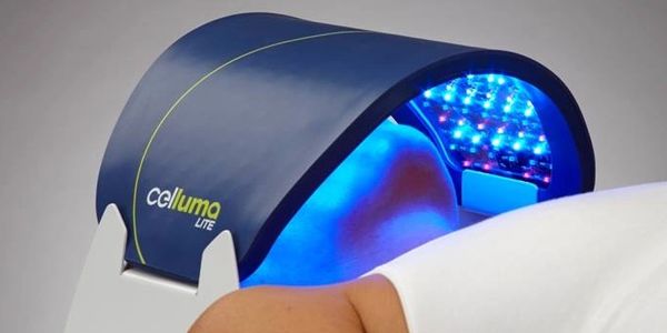 Woman laying under Celluma LED panel, Blue  LED, Light Emitting Diode, Professional-Grade LED Device.