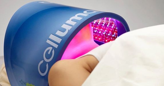 Woman laying under Celluma LED, Red  LED, Light Emitting Diode, Professional-Grade LED Device.